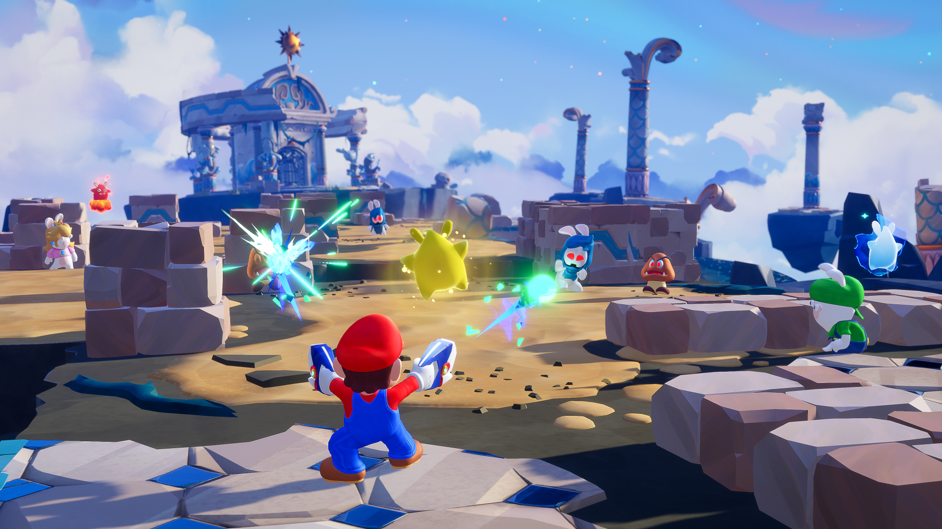 Mario und seine Freunde kämpfen gegen gelbe und blaue Kreaturen auf einer Wüstenwelt mit Ruinen.