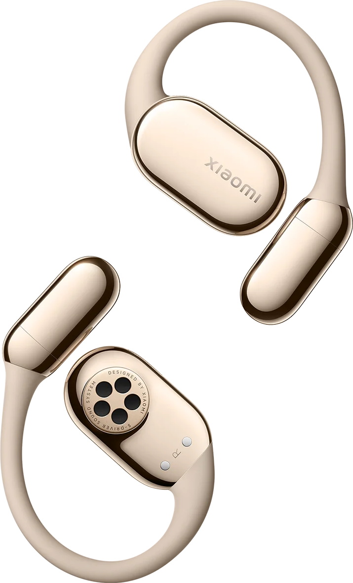 Deux écouteurs dorés Xiaomi avec des accents noirs et des détails argentés sur fond noir.