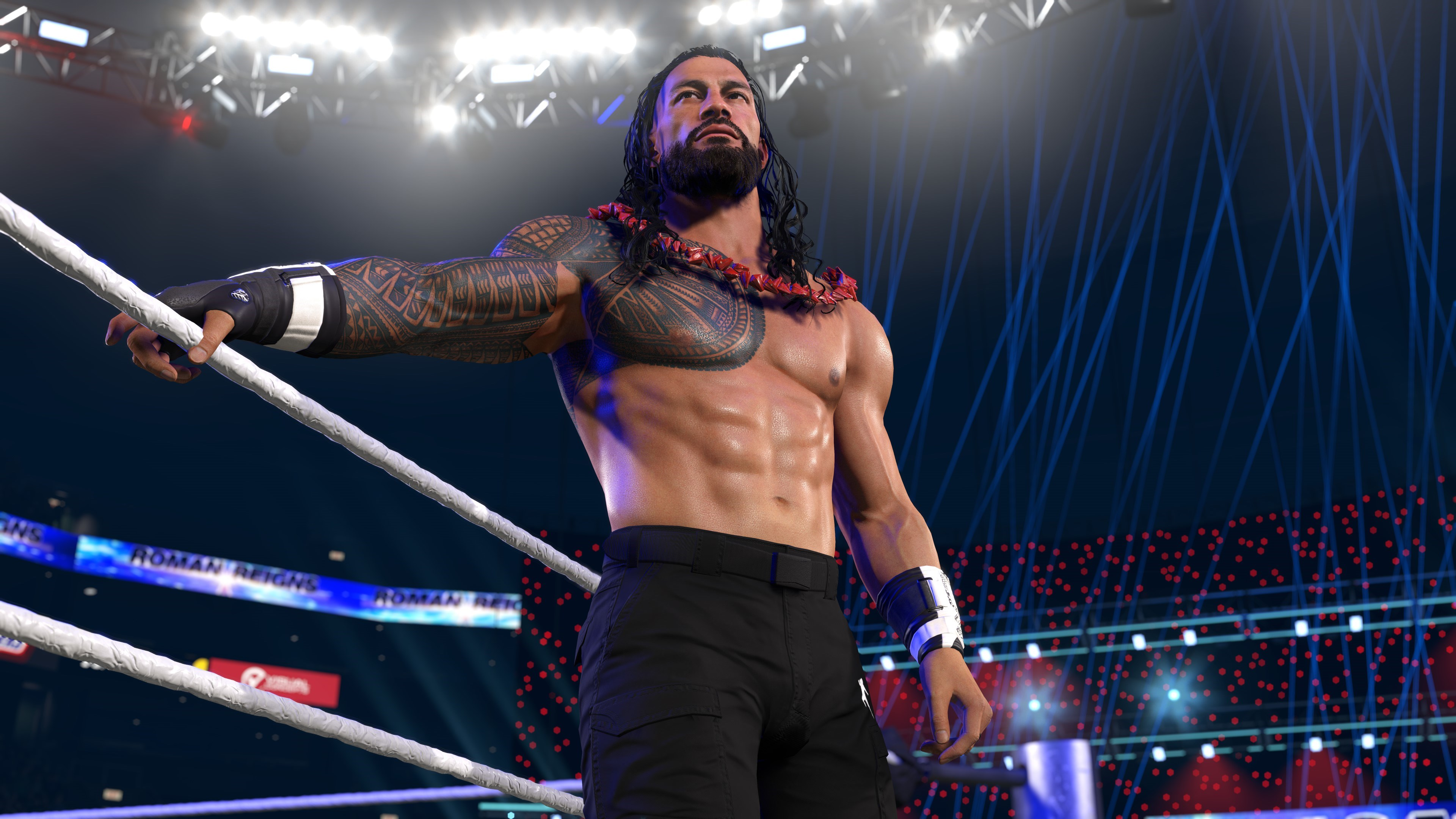 Un lutteur musclé avec des tatouages et un collier rouge est dans le ring.