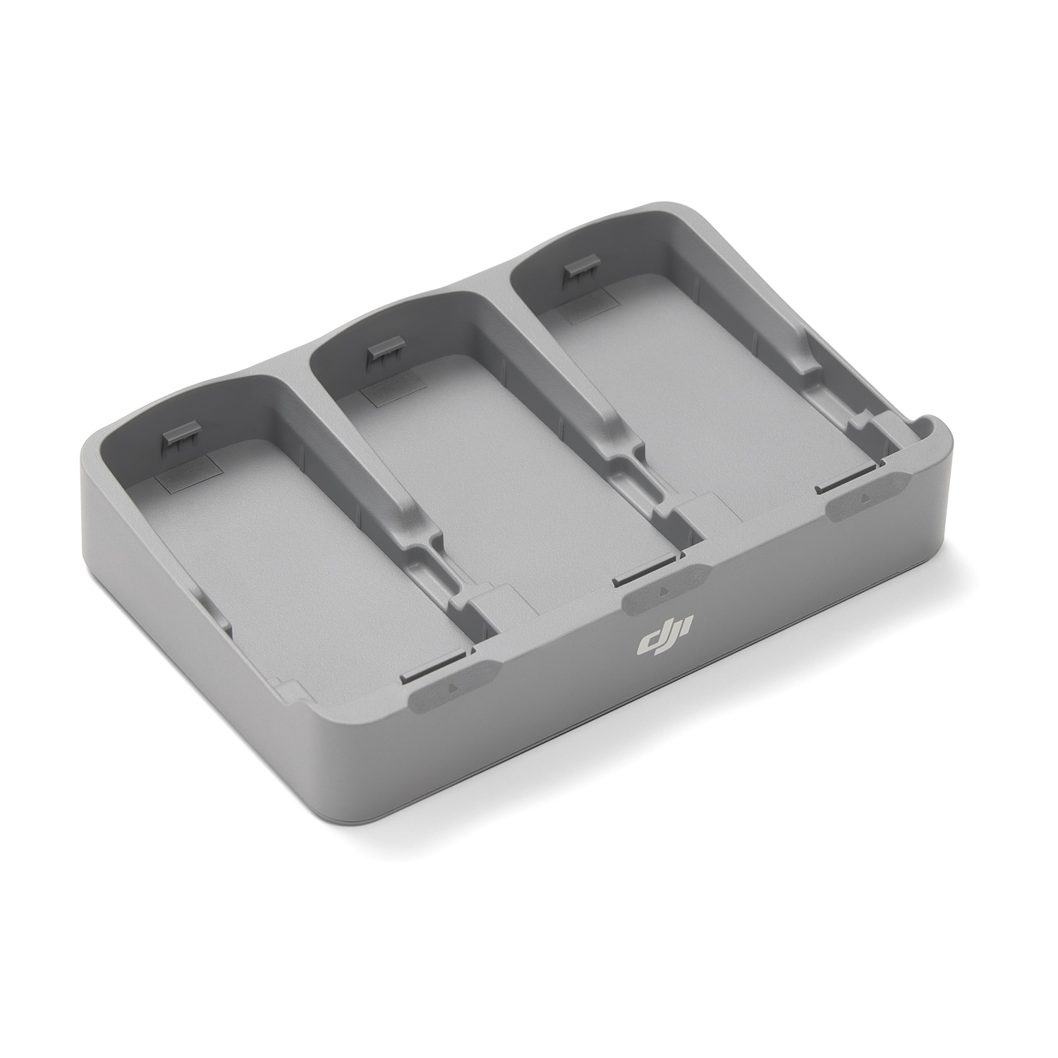 Hub di ricarica grigio a tre slot per batterie di droni con logo DJI.
