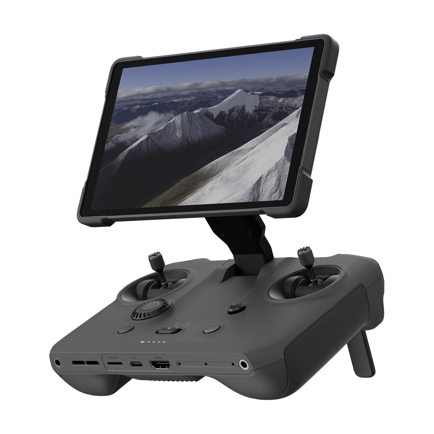 Controller drone grigio con tablet che mostra montagne innevate.