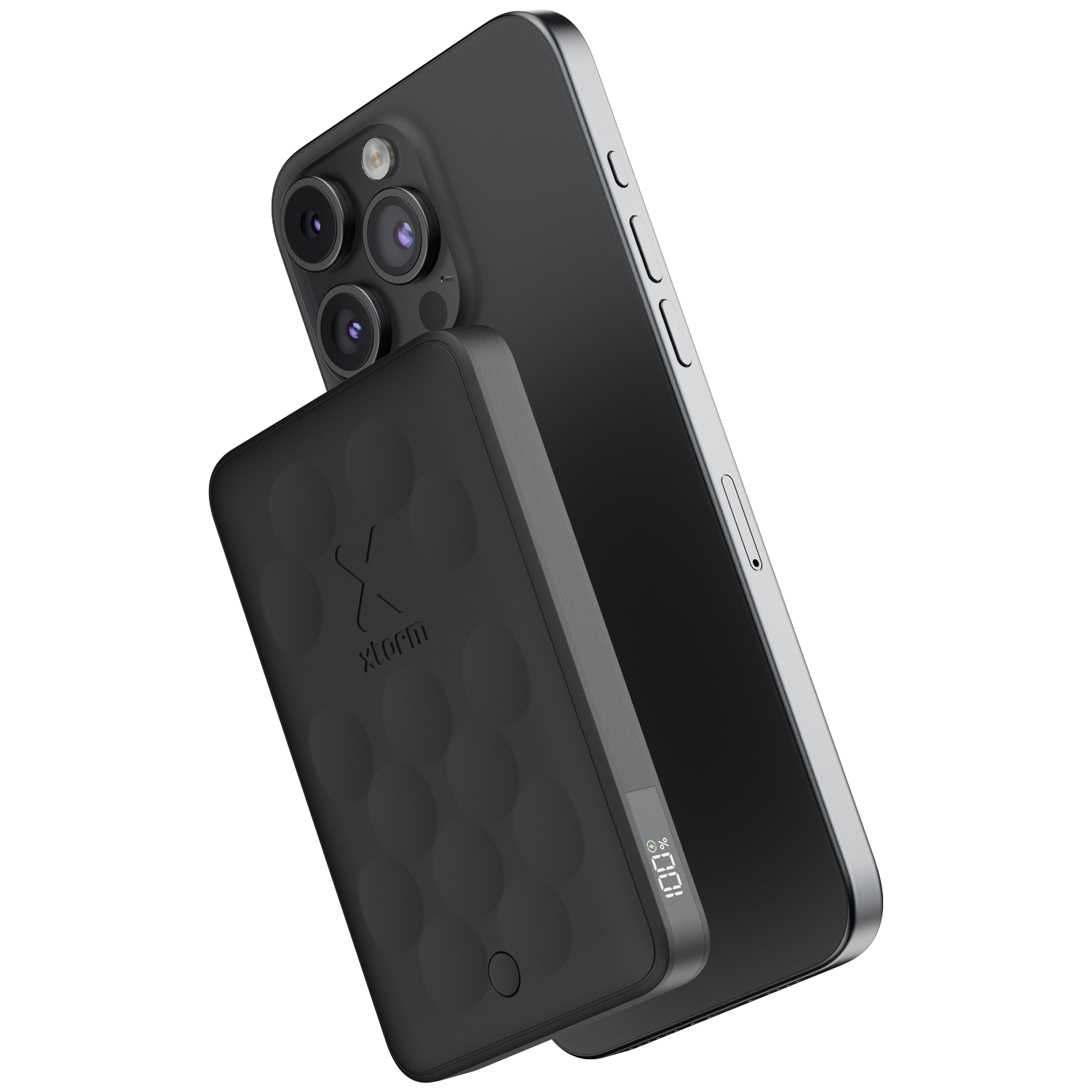 A black smartphone with a triple camera sits next to a black power bank.