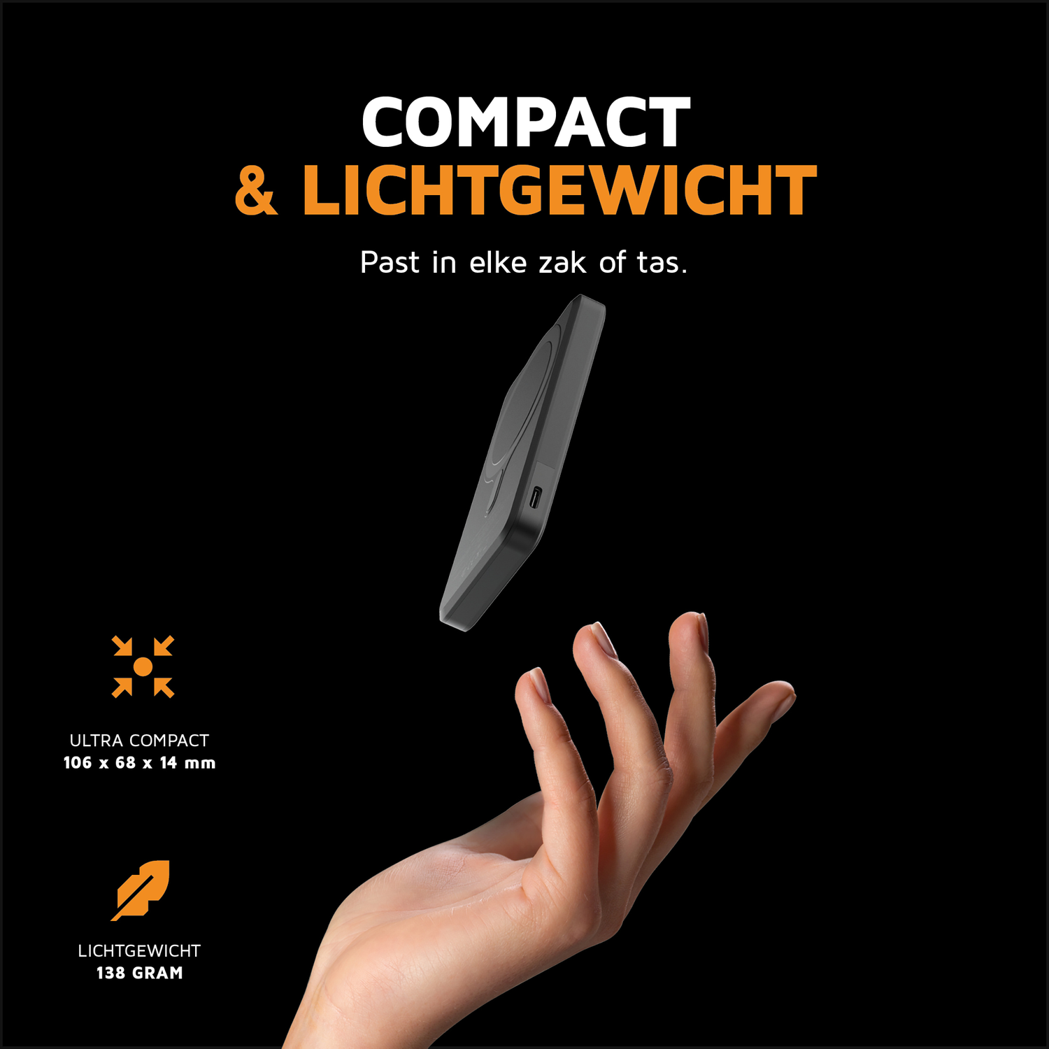 A hand catches a compact, gray device floating in the air.