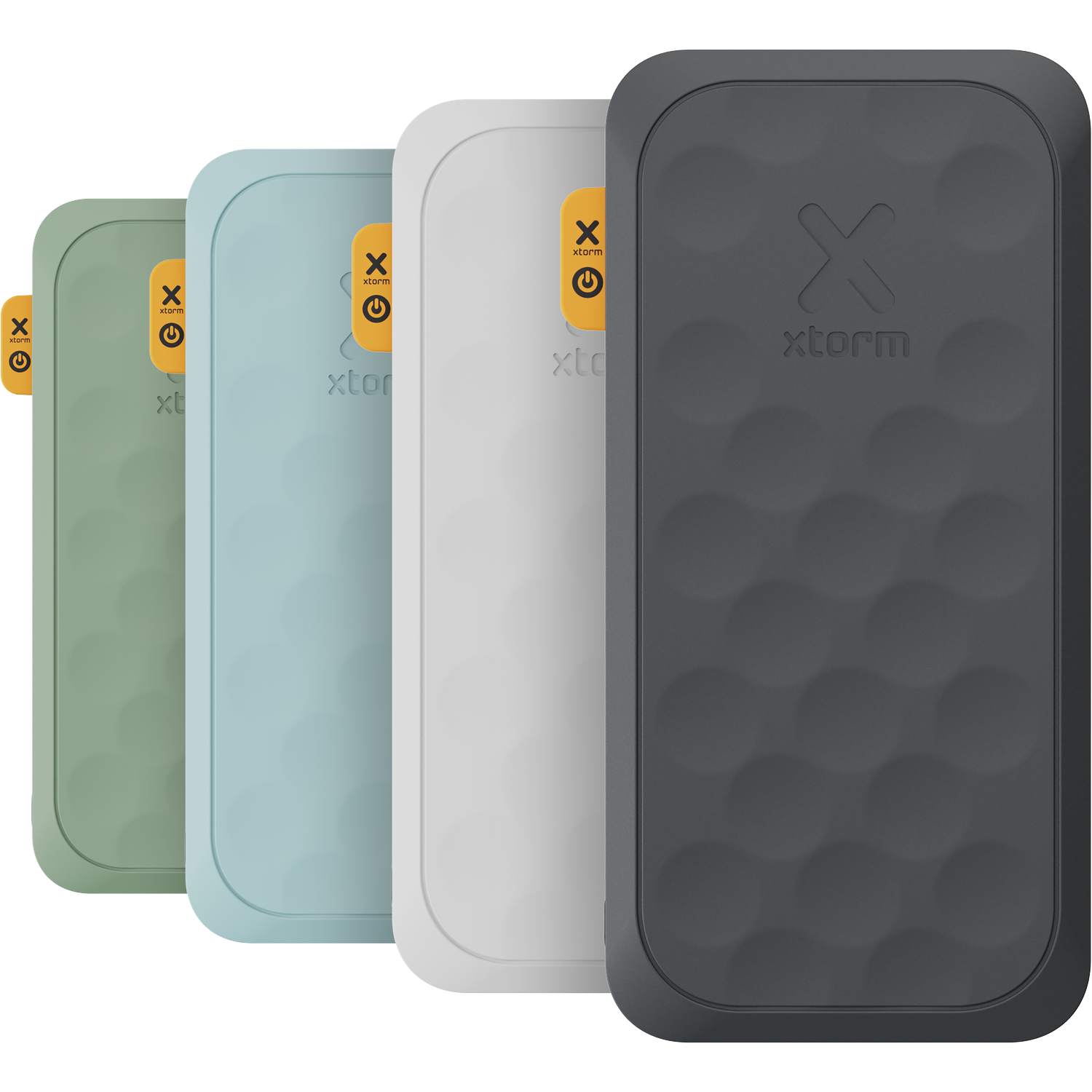 Four Xtorm power banks in green, blue, white, and dark gray lined up.