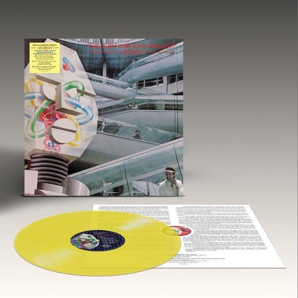 Gelbes Vinyl mit Albumcover: Robotergesicht, futuristische Architektur, Mann in Hut.