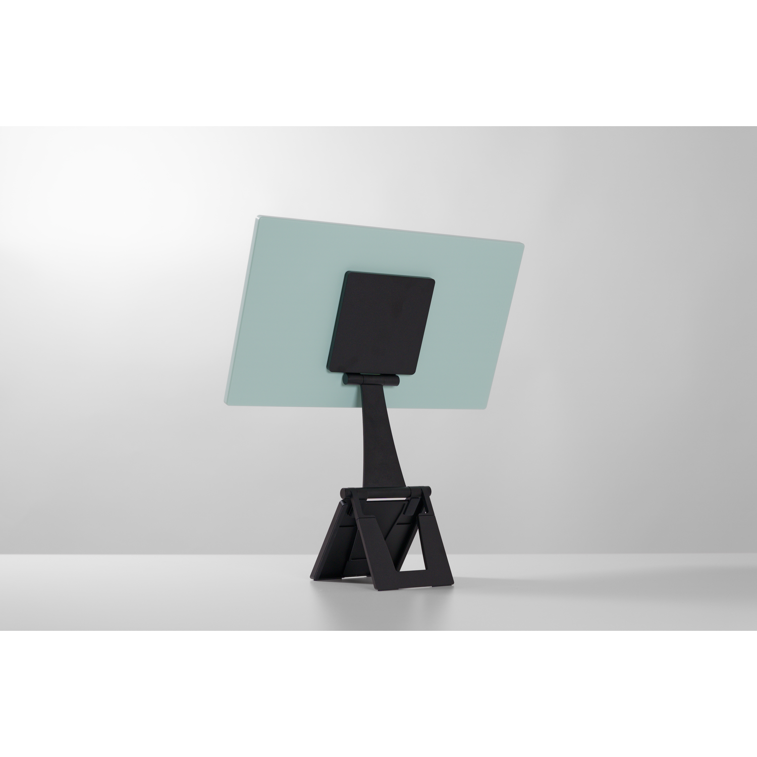 A light green rectangle with a black stand on a white background.