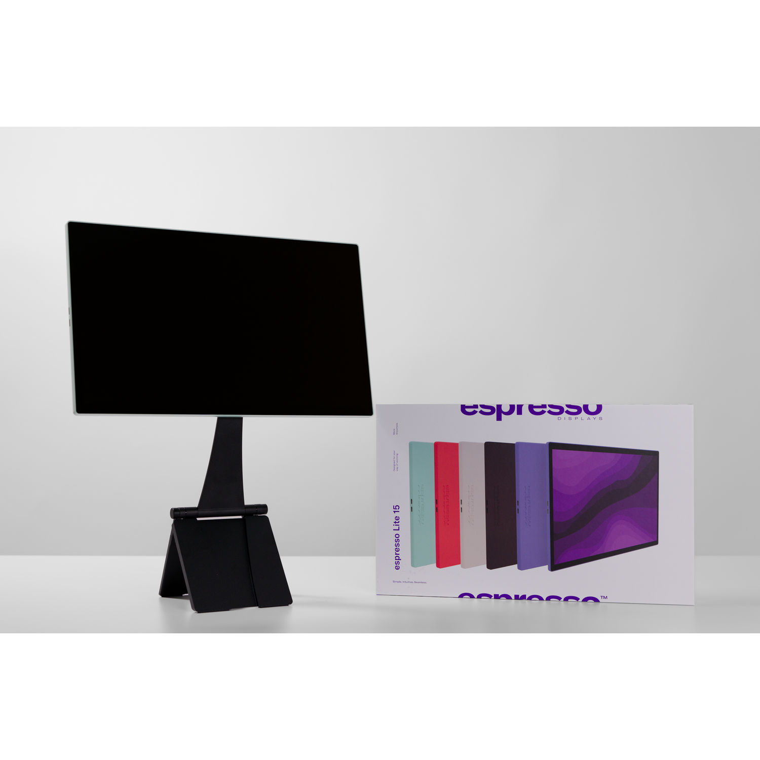 Black screen on stand beside box showing colored displays and brand logo.