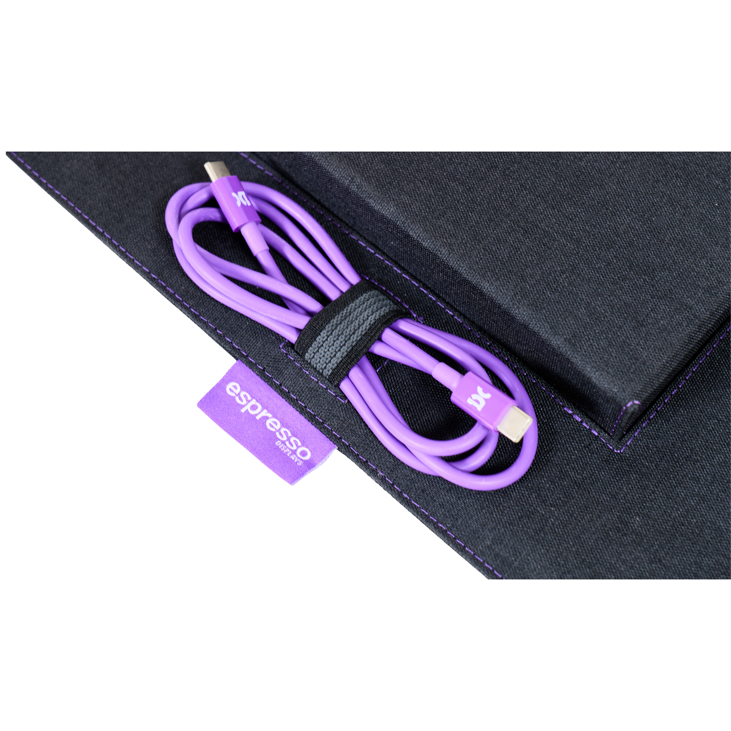 A purple USB-C cable with an "IX" logo, on a dark fabric surface.