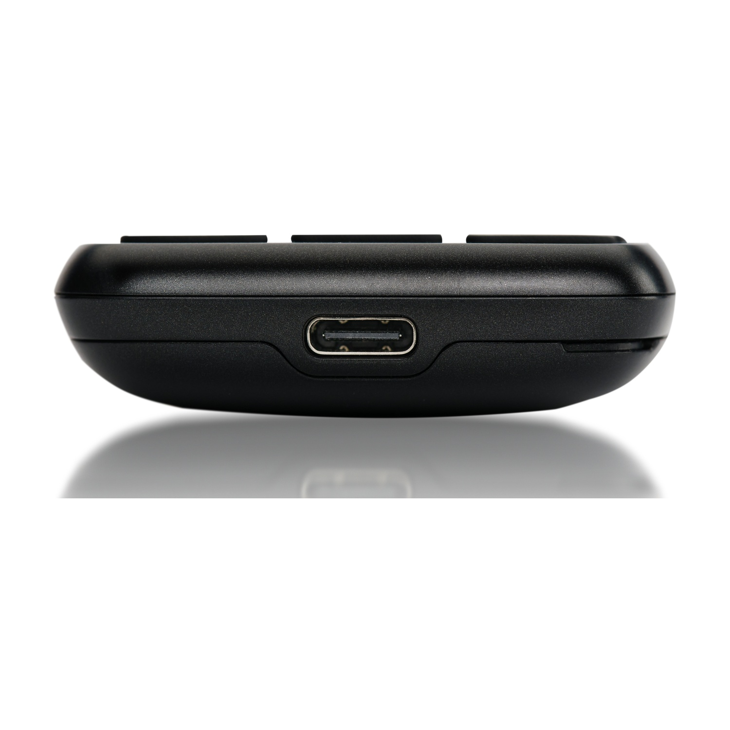 Dispositivo nero con porta USB-C e pulsanti, riflesso su sfondo bianco.
