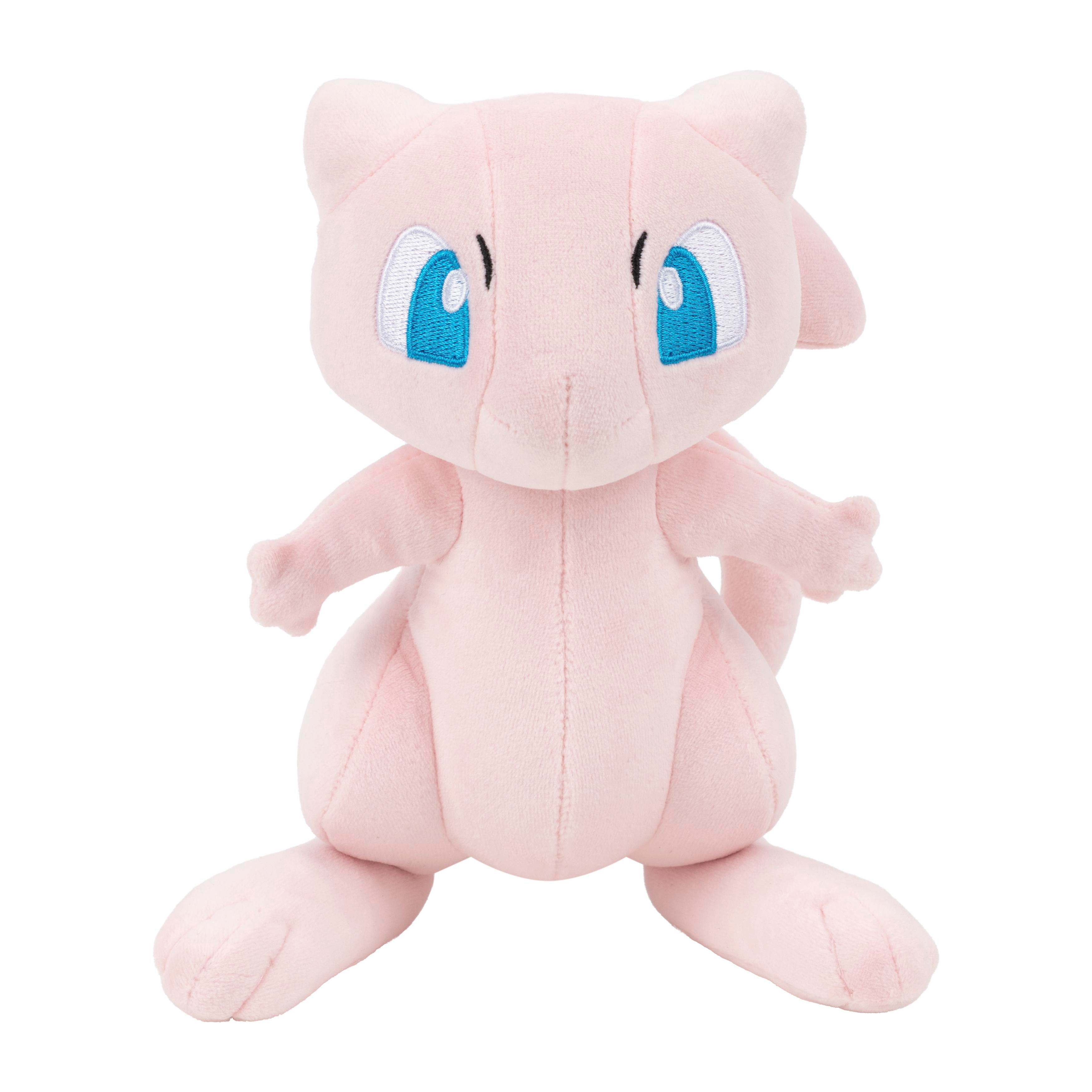 Ein rosa Plüschtier von Mew mit blauen Augen sitzt auf einem weißen Hintergrund.