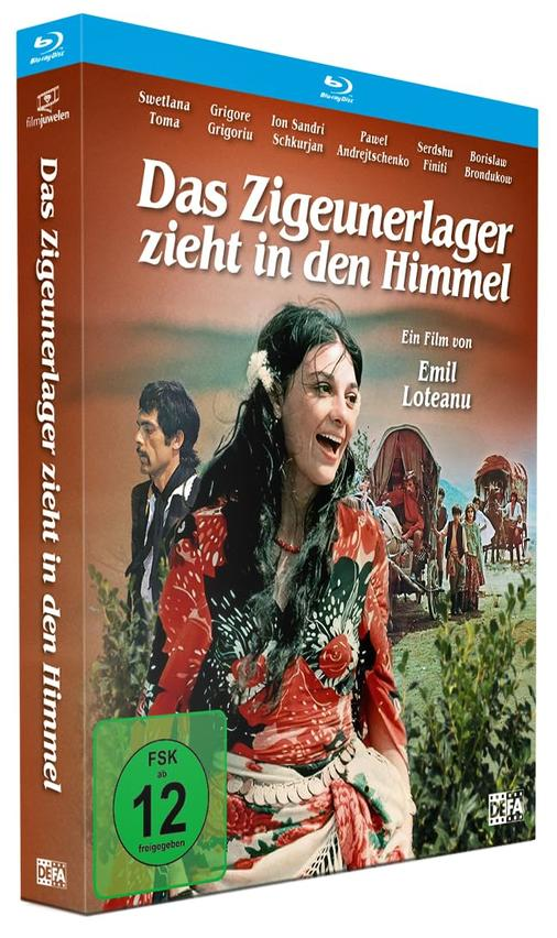Filmcover: Frau in Tracht lacht, Mann blickt zur Seite, Zigeunerwagen im Hintergrund.