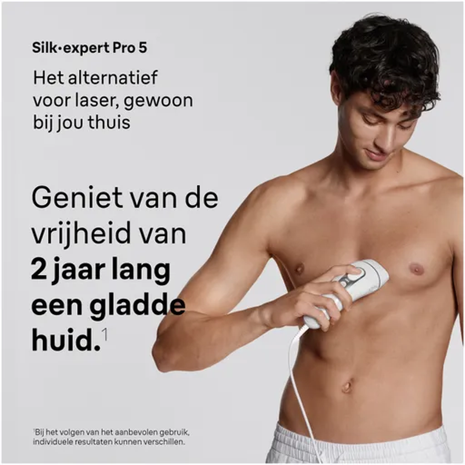 Man using IPL hair removal device on torso. Silk-expert Pro 5.