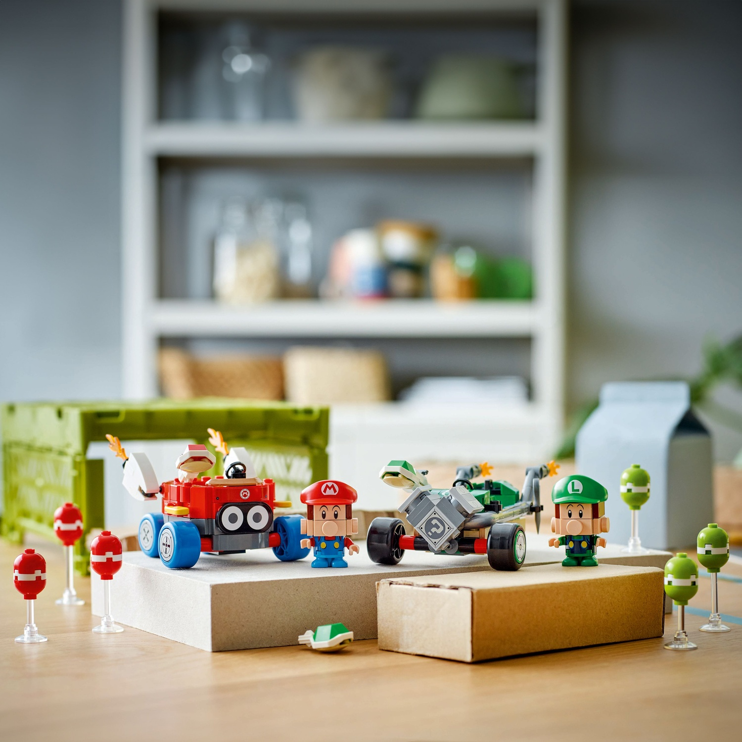 Mario and Luigi Lego figures with vehicles on a wooden table.