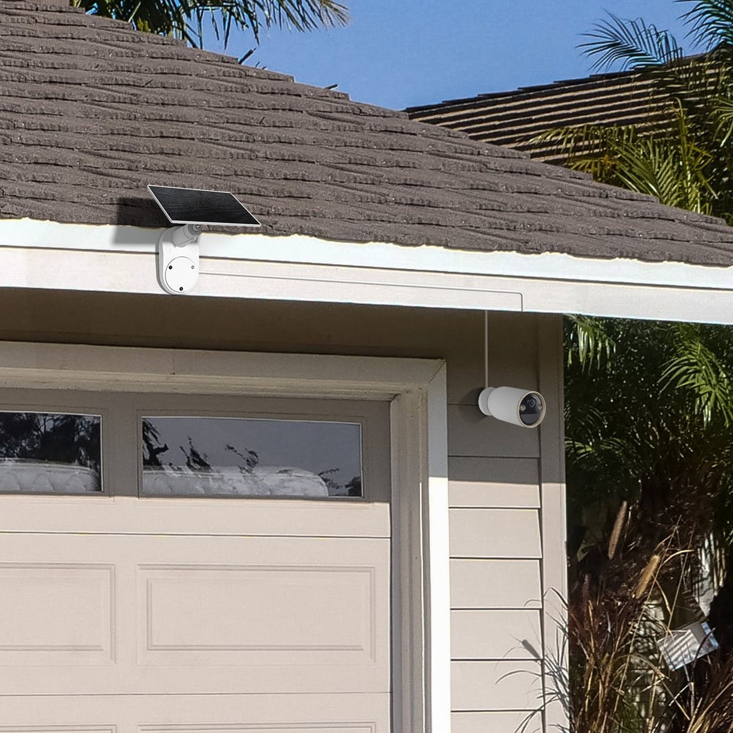 A solar panel and camera are mounted on a house.