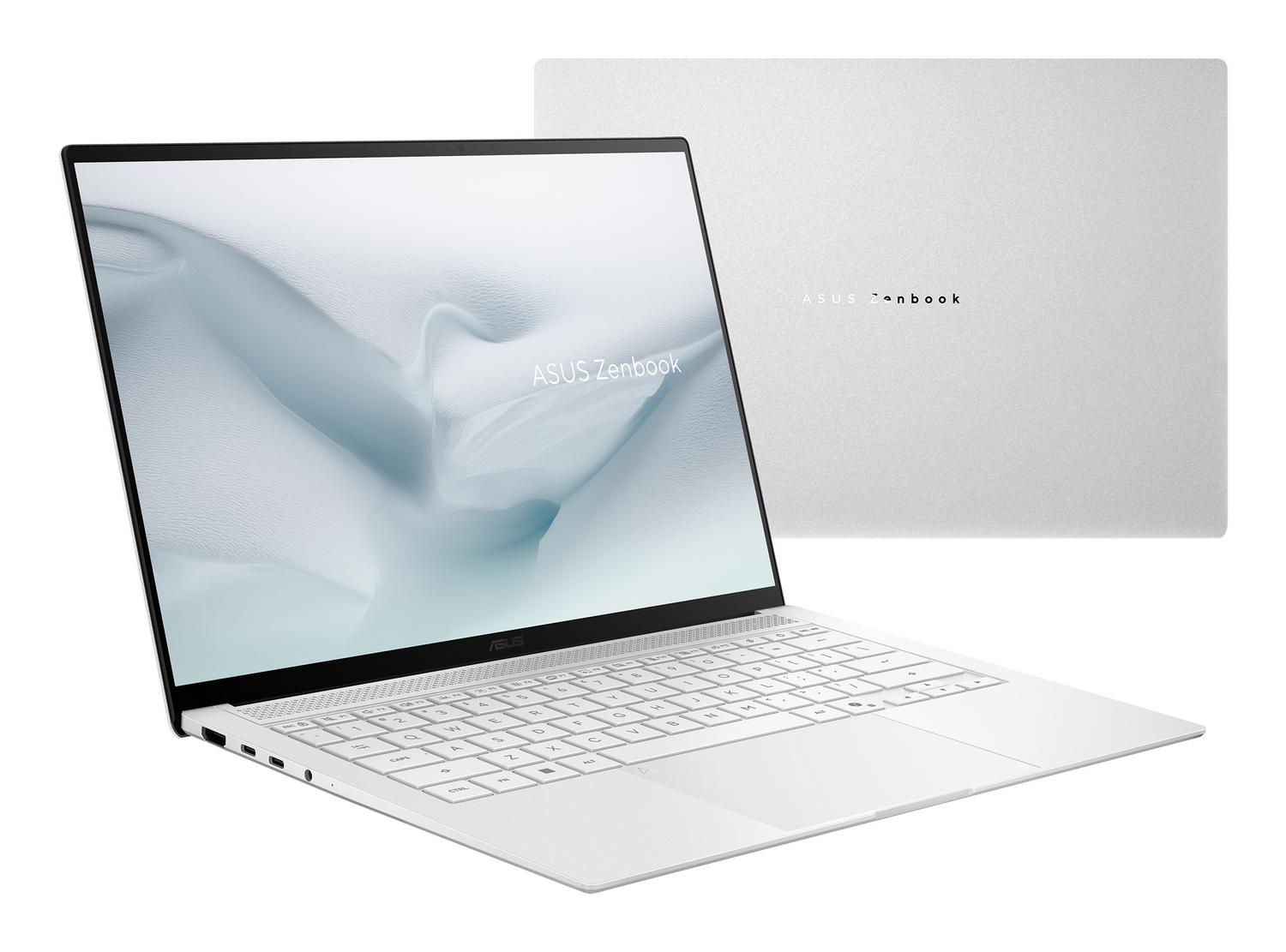 Un portátil ASUS Zenbook blanco, abierto, mostrando teclado y pantalla en primer plano.
