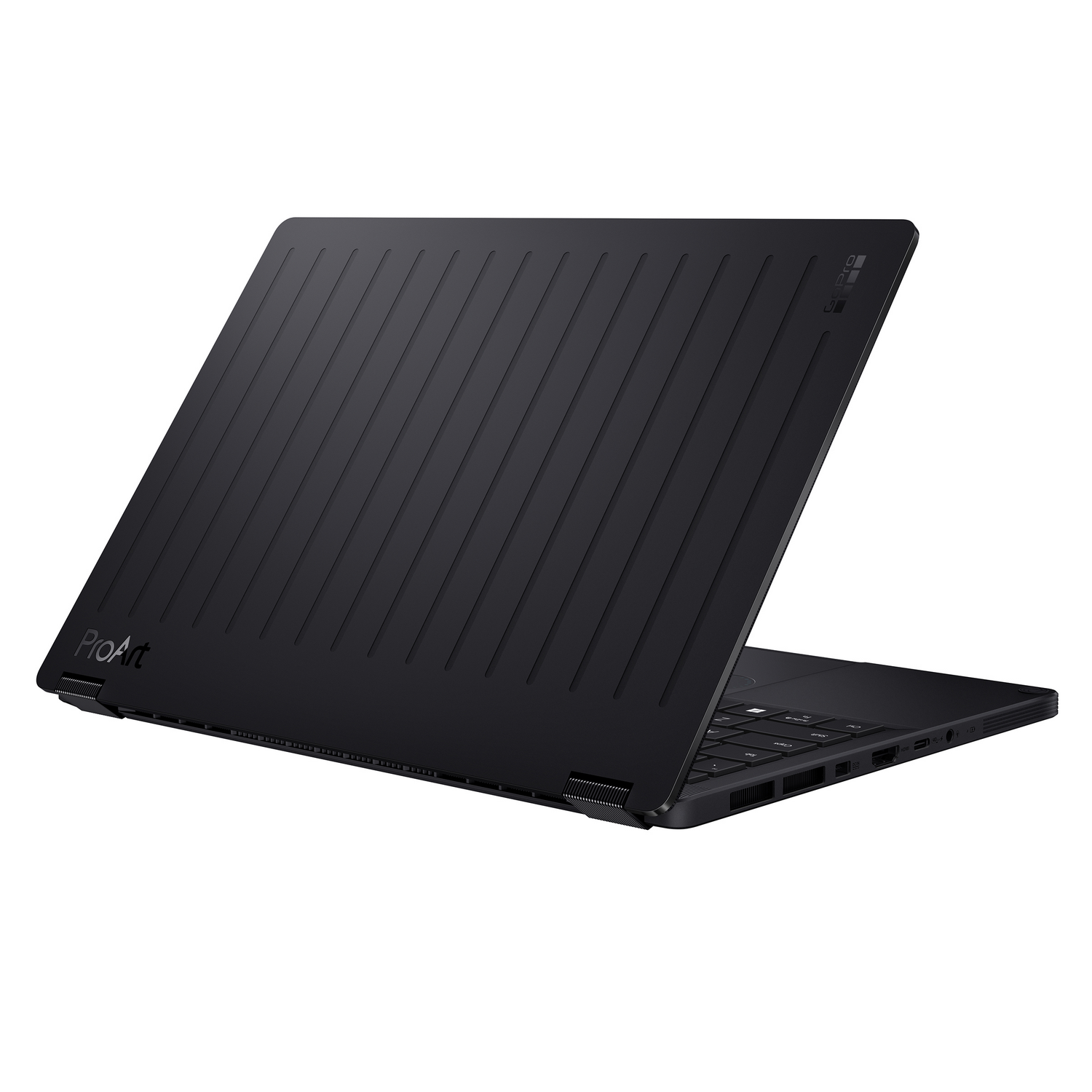Portátil negro con tapa acanalada y logo ProArt, parcialmente abierto.
