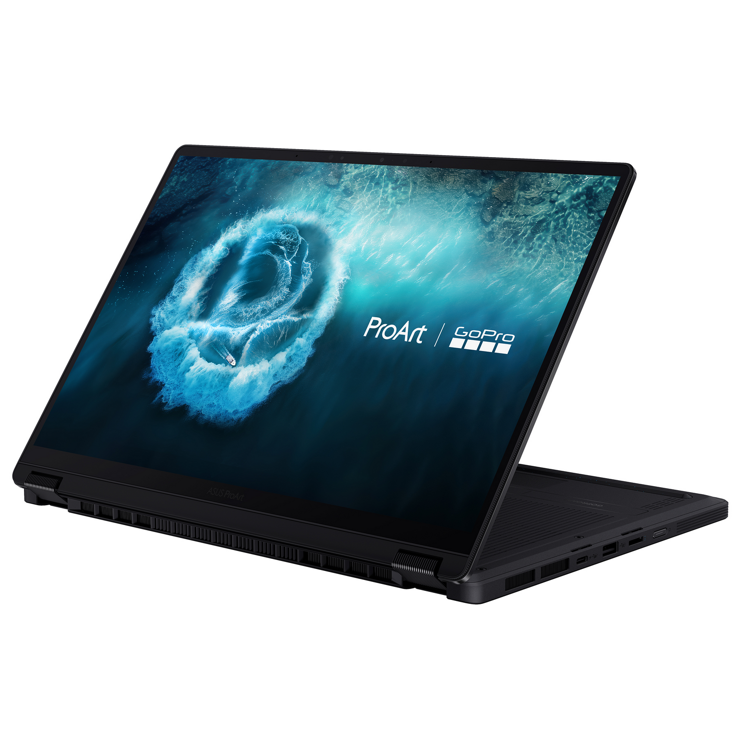 Portátil Asus ProArt negro abierto, mostrando un barco en un remolino en la pantalla.