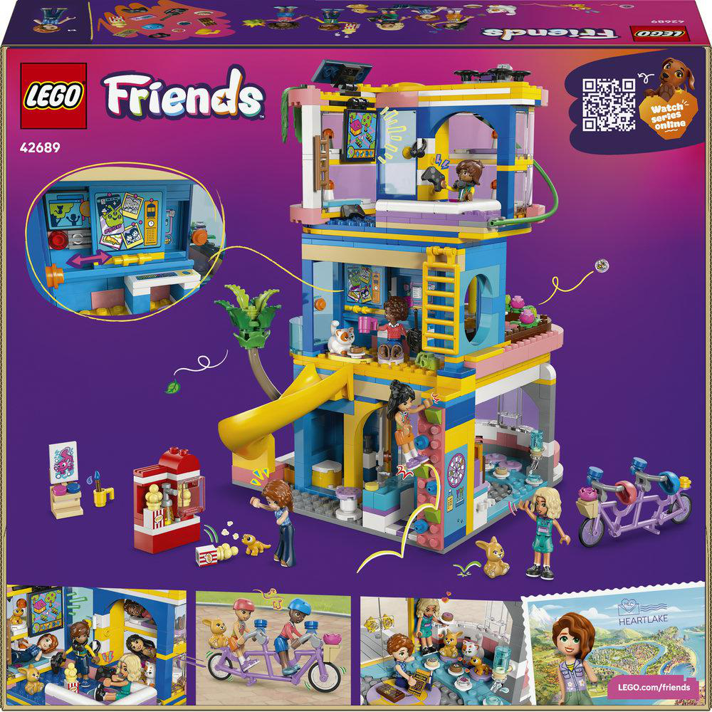 Lego Friends Haus mit Rutsche, Fahrrädern und Figuren.