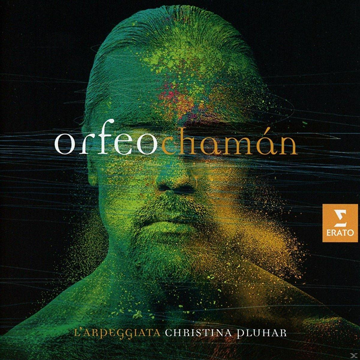 Zöld és sárga porral borított férfi, Orfeo Chamán felirat.