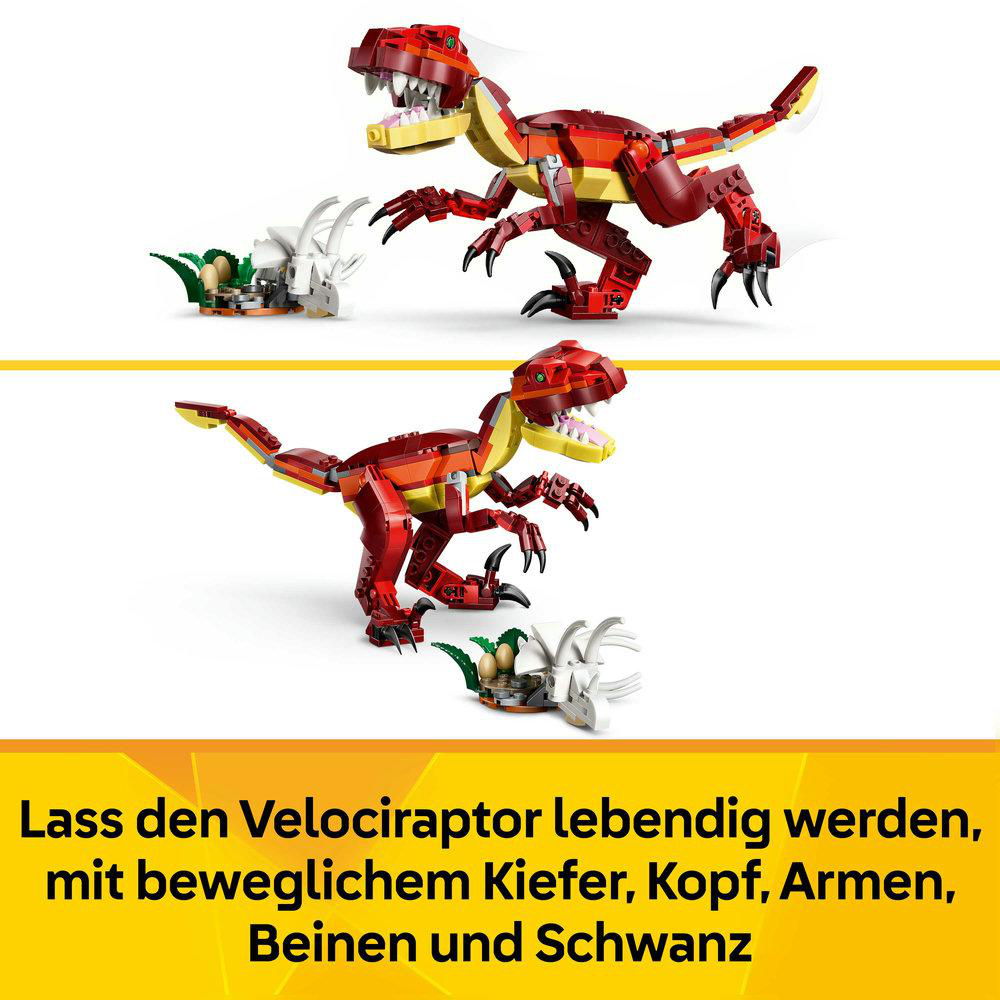 Zwei rote Lego-Velociraptoren mit beweglichen Teilen und grünen Pflanzen.
