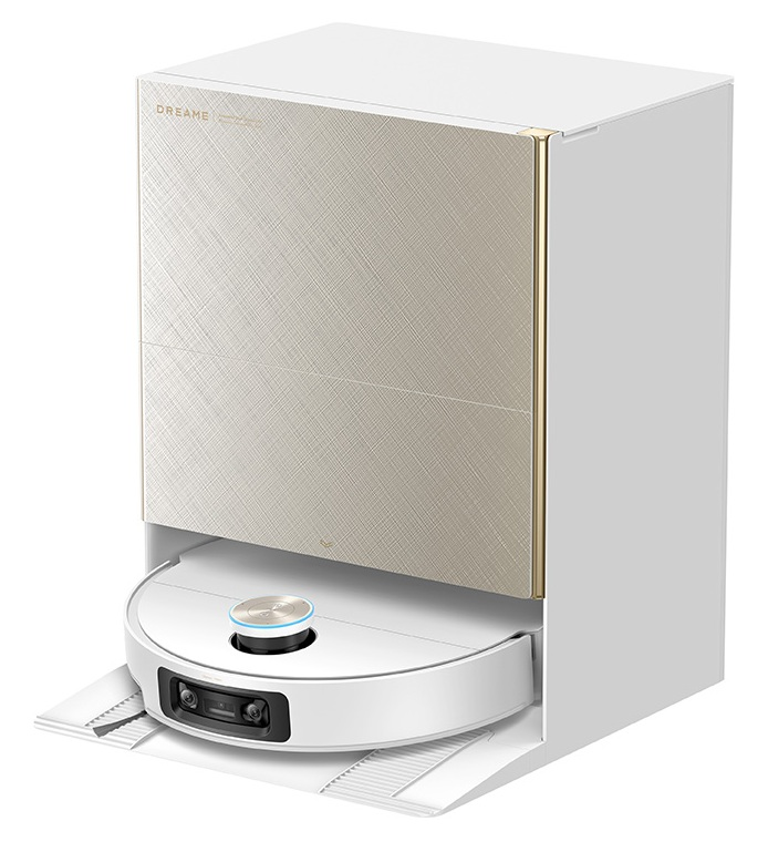 Biały robot sprzątający z kamerami stoi w stacji ładującej z beżowym frontem.