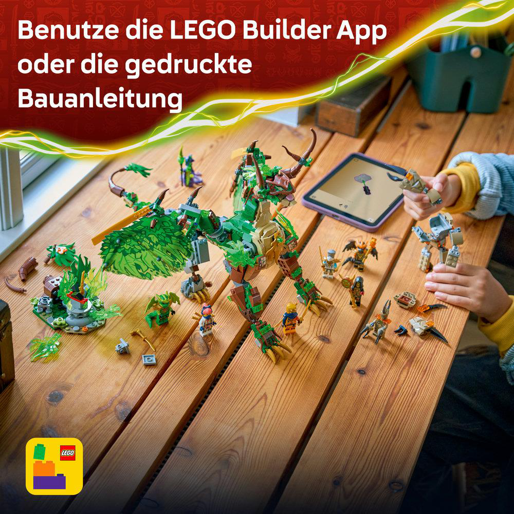 Lego-Bausatz mit einem grünen Drachen, Minifiguren und einem Tablet auf einem Holztisch.