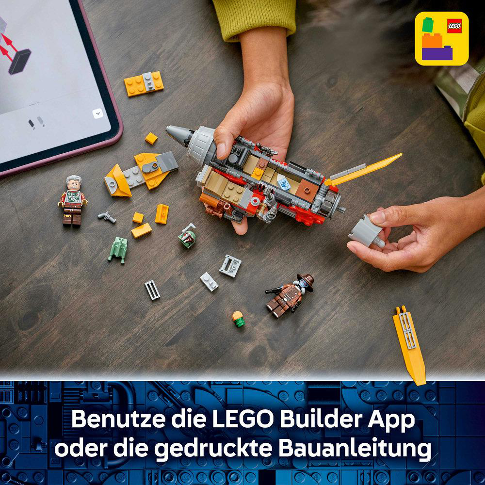 Kinder bauen ein Raumschiff aus Lego-Steinen mit einer Anleitung auf einem Tablet.