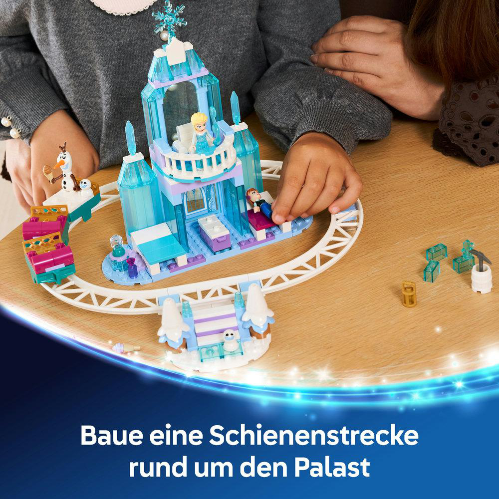 Bauen Sie eine Schienenstrecke um den Eispalast mit Figuren und Zubehör.