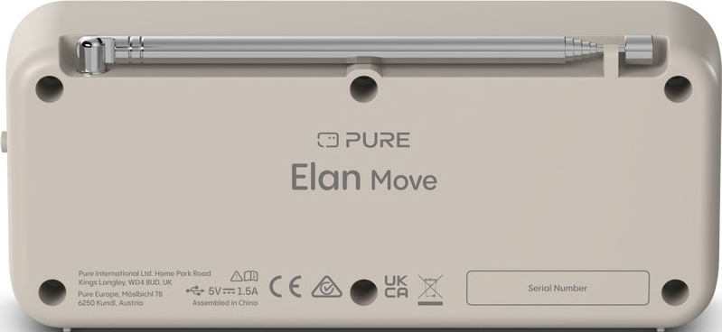 Arrière d'une radio beige avec antenne extensible et étiquettes.