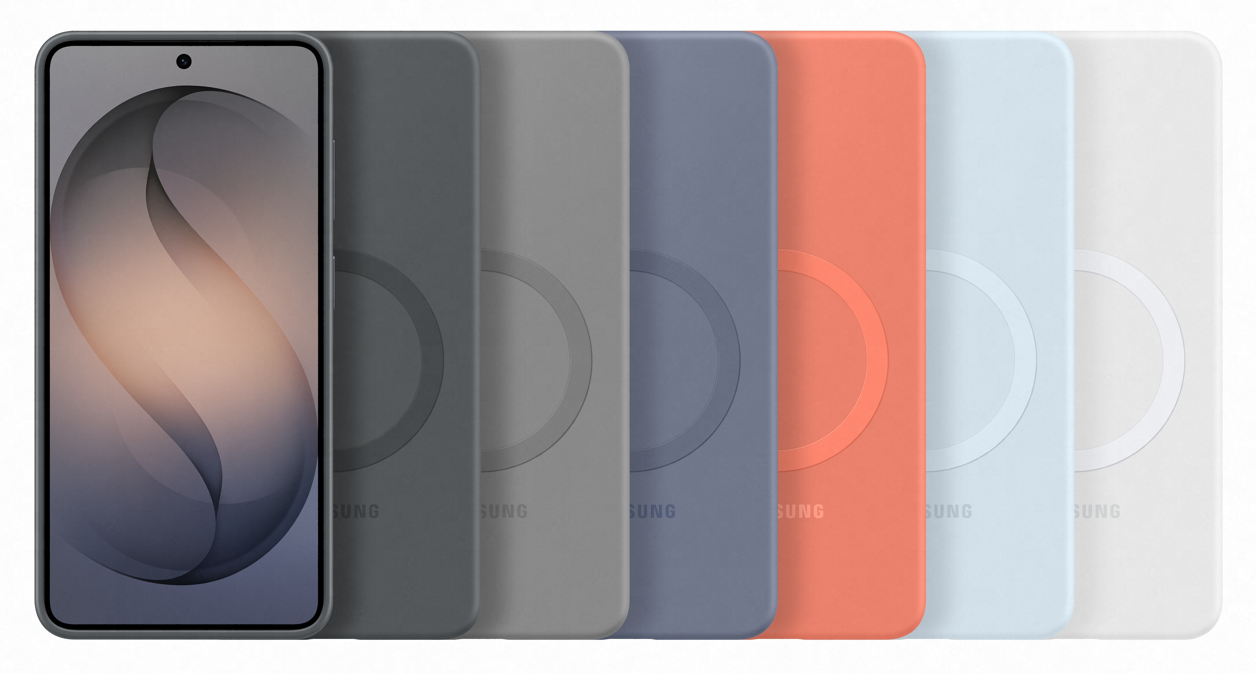 Smartfon z szarą ramką, obok kilka etui na telefon.