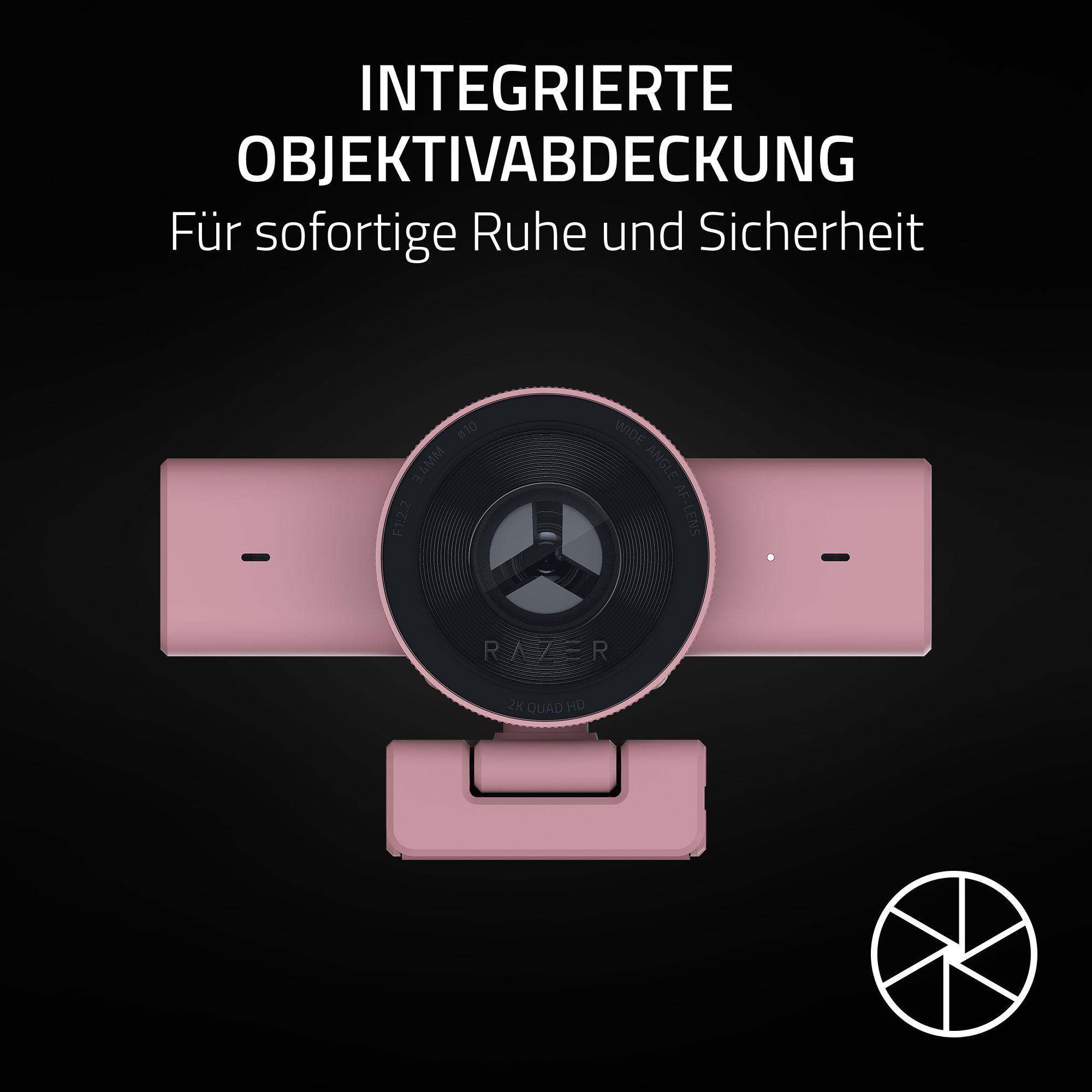 Eine rosafarbene Webcam mit integrierter Objektivabdeckung und dem Razer-Logo.