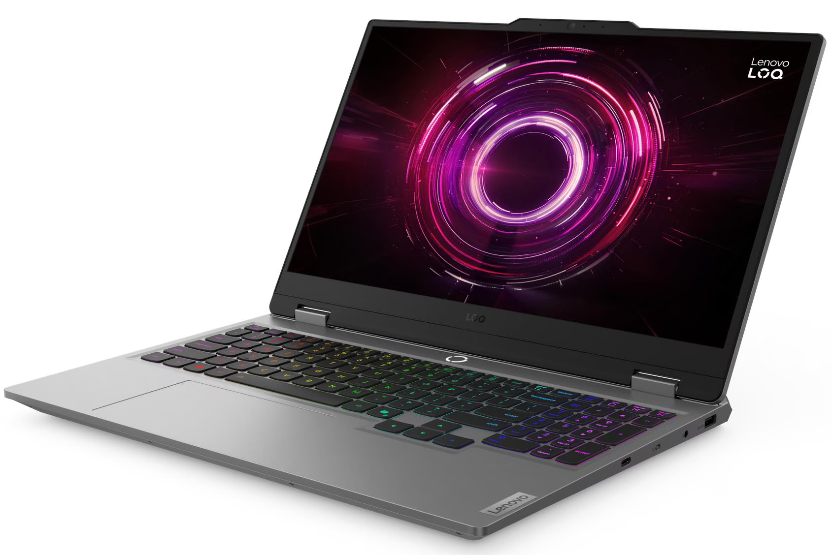 Ezán egy ezüst laptop, háttérvilágított billentyűzettel és képernyőn látható lilás/narancssárga körrel.