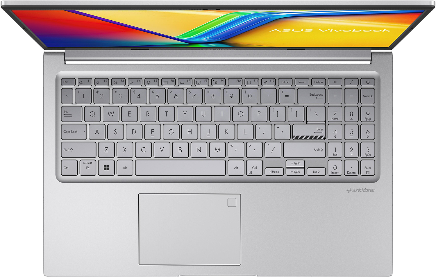 Egy ezüst laptop nyitott képernyővel, billentyűzet látható. Színes képernyő háttér.