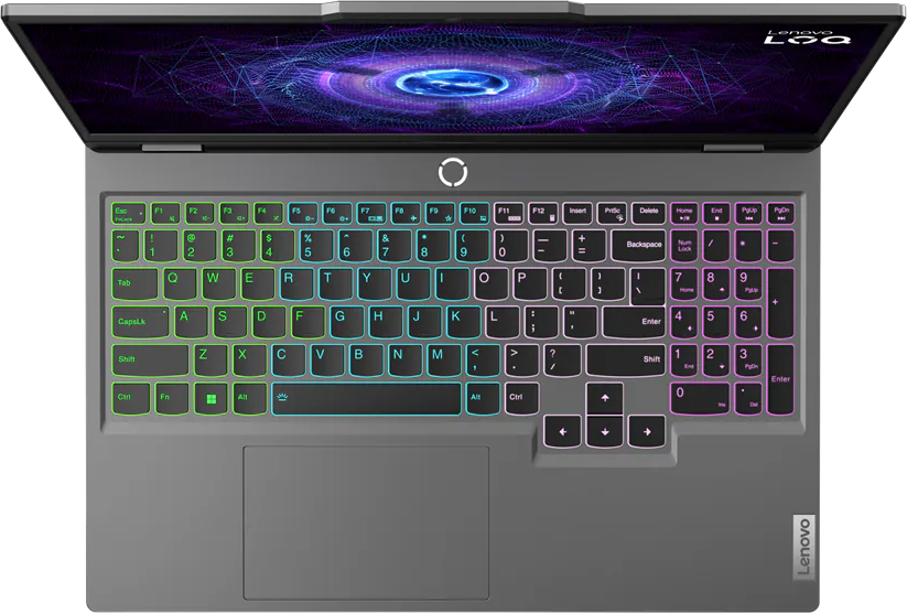 Nyitott laptop világító billentyűzettel és digitális háttérrel.