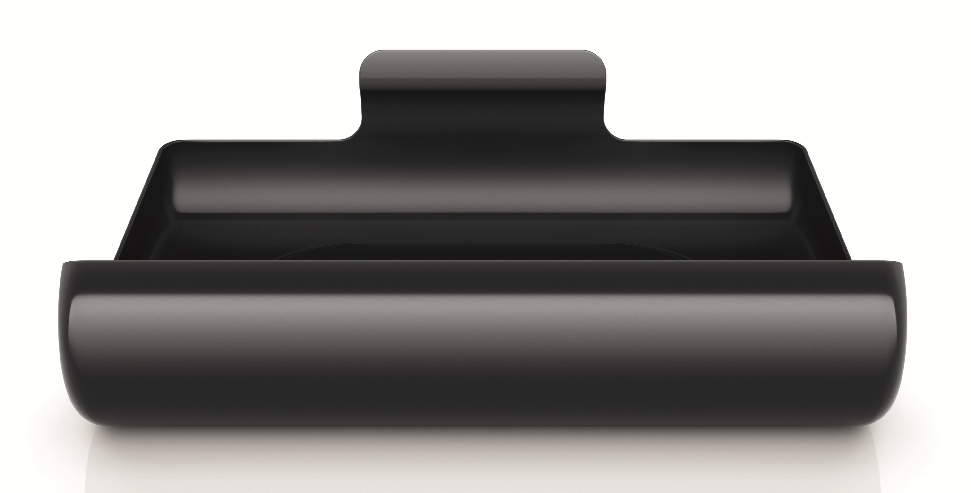 Błyszczący, czarny, prostokątny przedmiot przypominający tacę lub miskę.