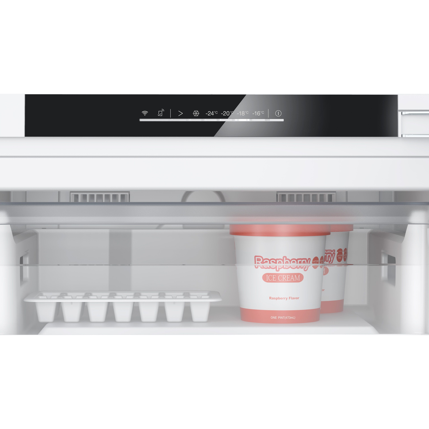 Ice cream tubs in a refrigerator with an ice cube tray.