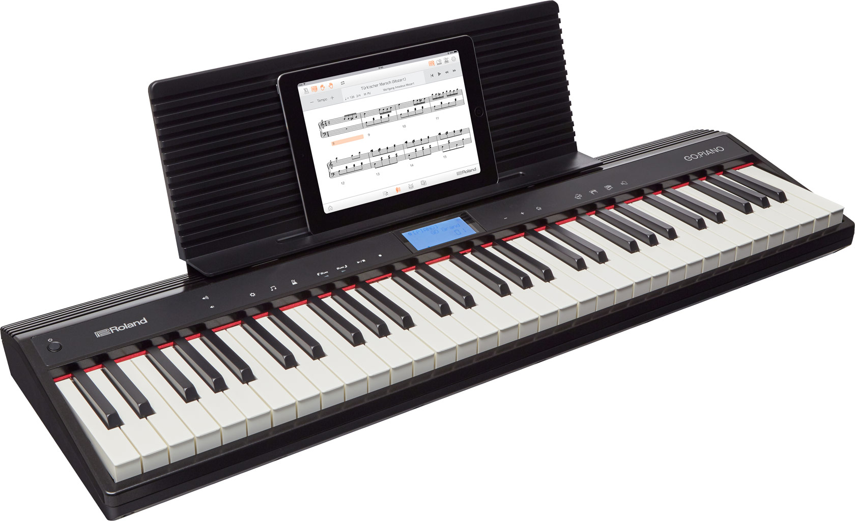 Roland GO:PIANO noir avec tablette affichant des partitions.