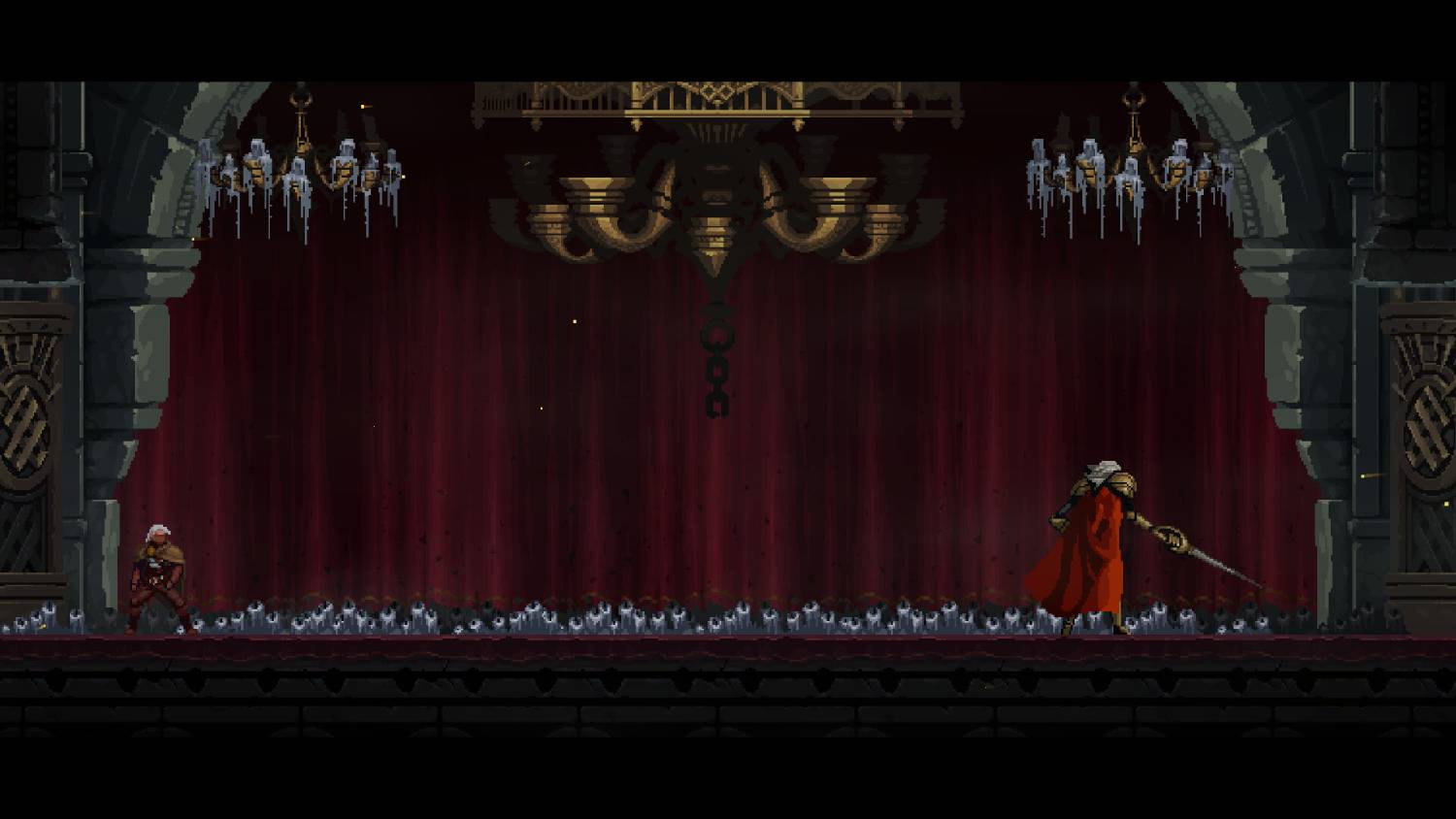 Dos figuras en un escenario con cortinas rojas y un candelabro. Una figura con capa roja.