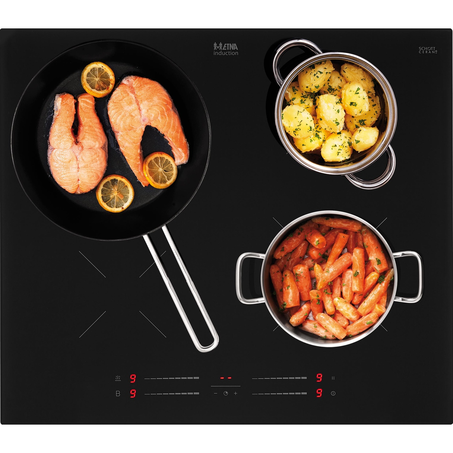 Saumon dans une poêle, pommes de terre et carottes dans des casseroles sur plaque.