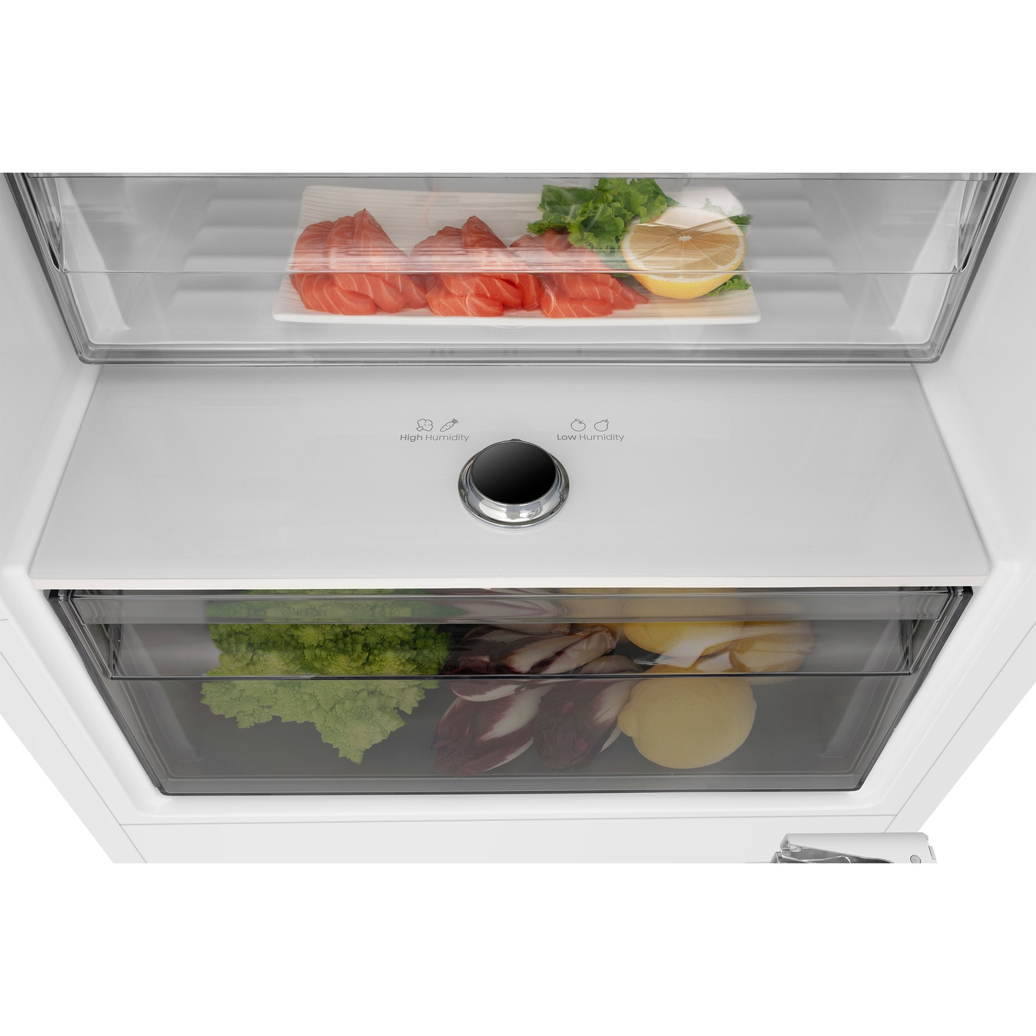 Raw salmon, lemon, and lettuce in a drawer; vegetables below.