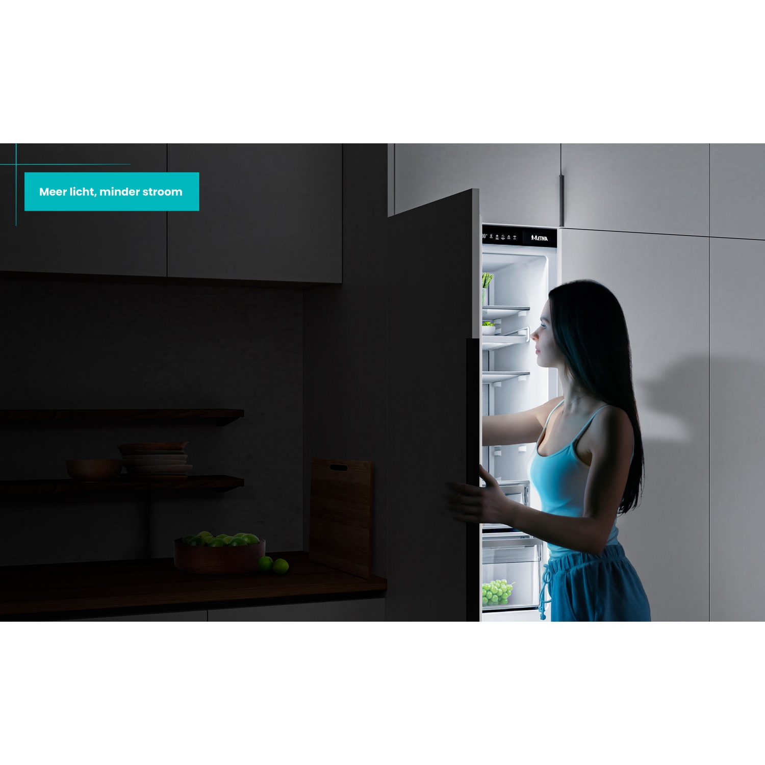 A woman opens a lit refrigerator in a dark kitchen.