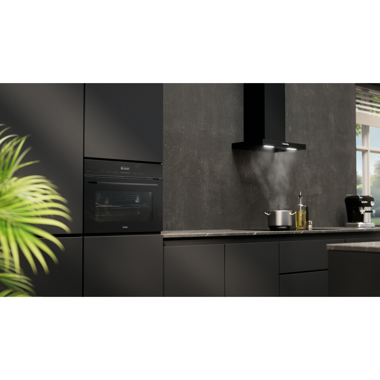 Modern black kitchen with oven, extractor hood, and cooking pot.