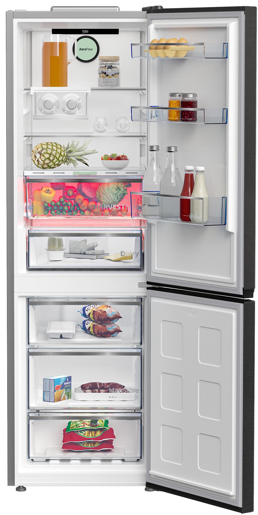 Otwarta lodówka wypełniona jedzeniem: dzbanek z sokiem, jajka, owoce, warzywa, mrożonki.