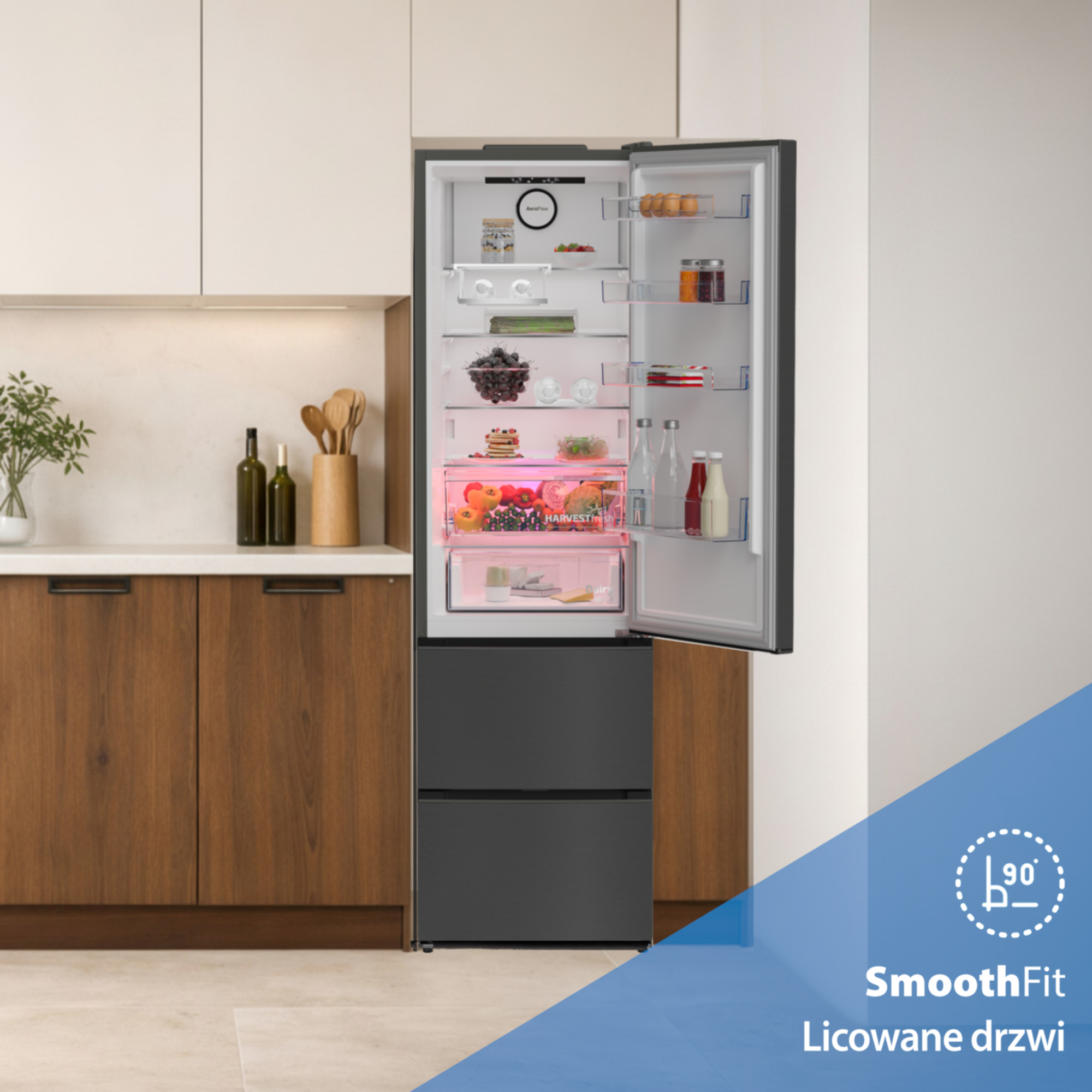 Otwarta lodówka z jedzeniem i szufladami. Gładkie drewniane elementy obok.