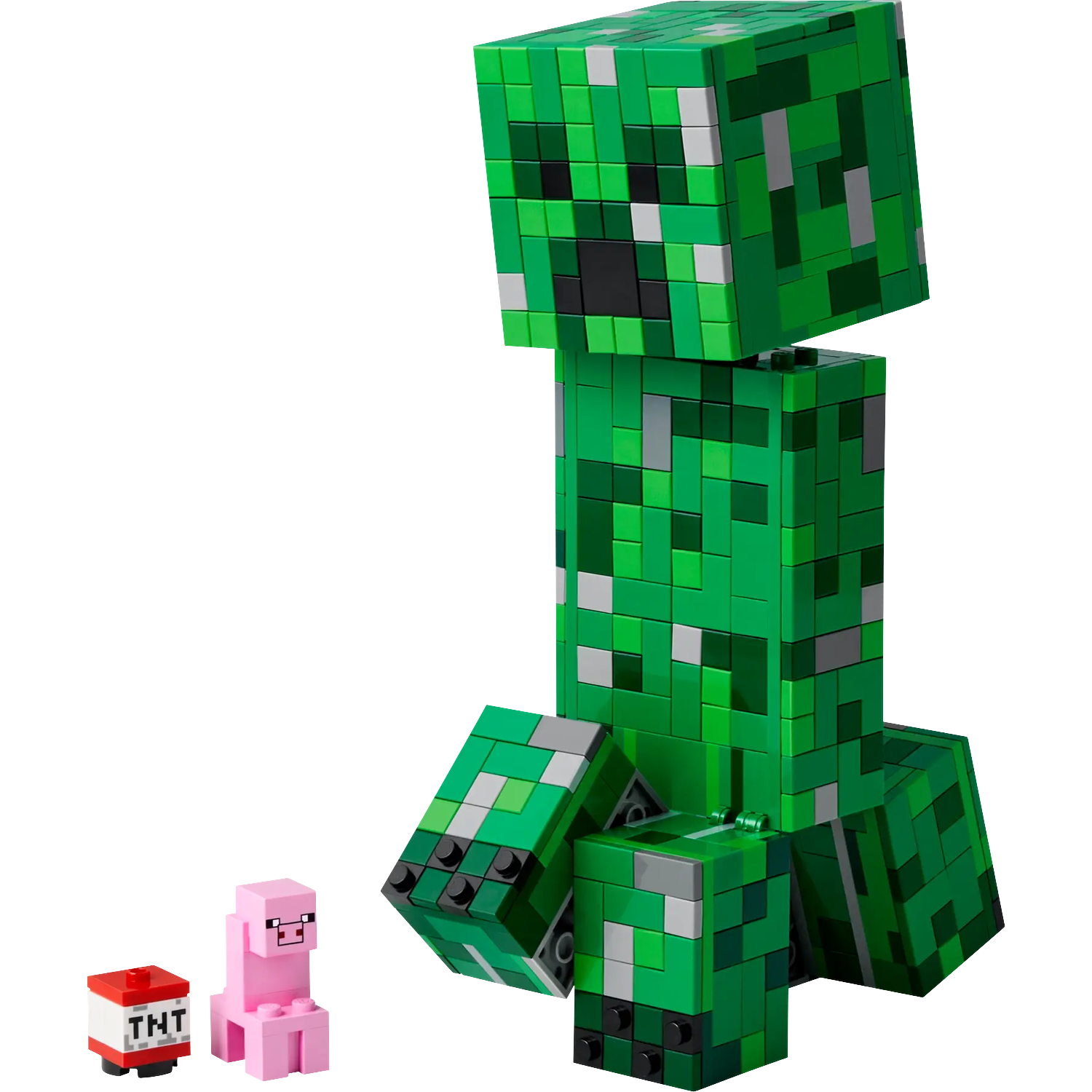 A green Lego Creeper sits next to a pink Lego pig and TNT.