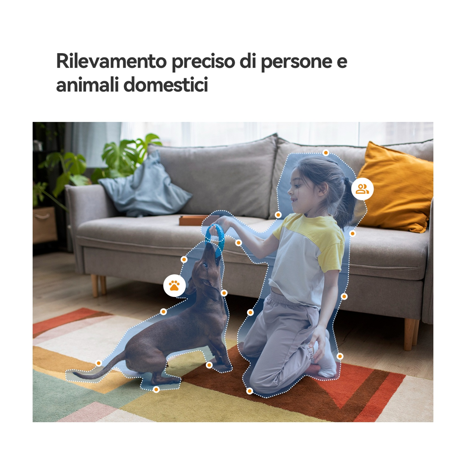 Una bambina gioca con un cane su un tappeto in salotto.