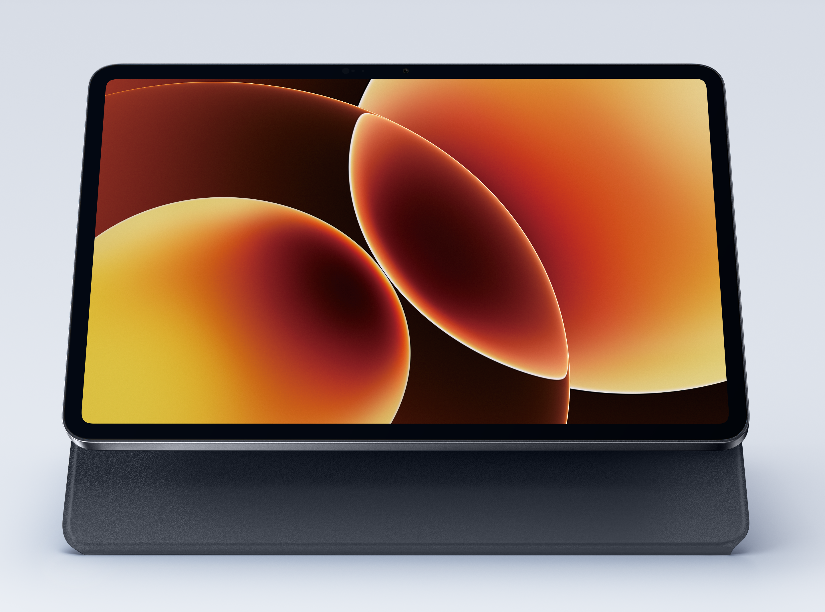 Tablet w ciemnej obudowie z pomarańczowo-żółtą abstrakcyjną tapetą.