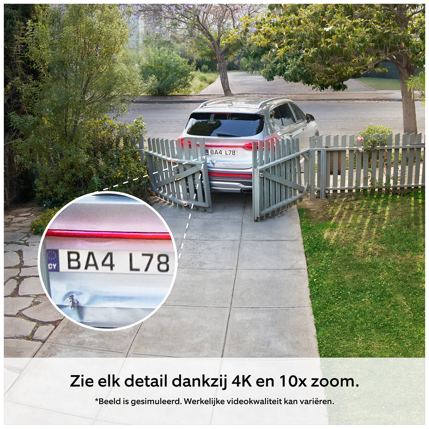 A silver car with license plate BA4 L78 is parked in front of a wooden fence.