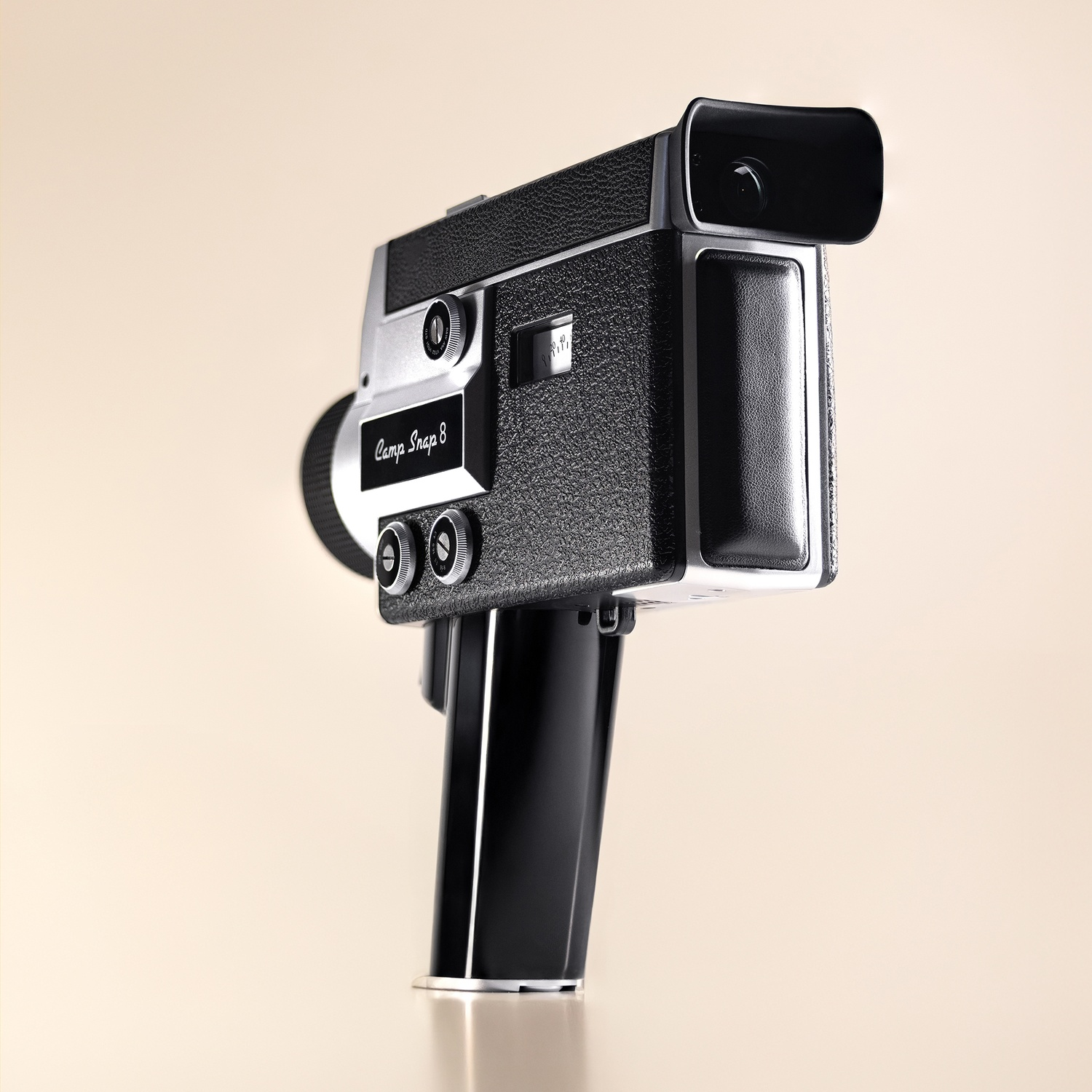 A vintage camera with black faux leather and silver accents.
