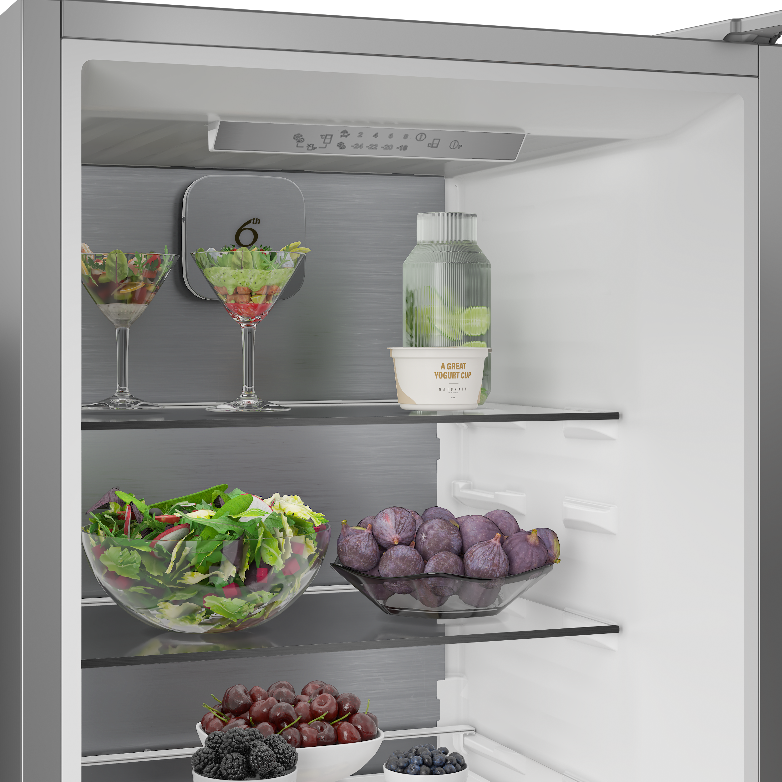 Lodówka z sałatkami, owocami i jogurtem na półkach.